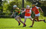 21 April 2024; Abhainn Coady of Carlow in action against Jessica Traynor and Caitlin Byrne of Armagh during the Electric Ireland All-Ireland Camogie Minor B semi-final match between Armagh and Carlow at Dunganny in Meath. Photo by Sam Barnes/Sportsfile