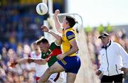 21 April 2024; Ruaidhrí Fallon of Roscommon in action against Ryan O'Donoghue of Mayo during the Connacht GAA Football Senior Championship semi-final match between Roscommon and Mayo at Dr Hyde Park in Roscommon. Photo by Piaras Ó Mídheach/Sportsfile