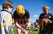 21 April 2024; Richie Reid of Kilkenny signs the hurl of a supporter after his side's victory in the Leinster GAA Hurling Senior Championship Round 1 match between Kilkenny and Antrim at UMPC Nowlan Park in Kilkenny. Photo by Shauna Clinton/Sportsfile