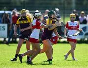 21 April 2024; Shauna Mac Sweeney of Wexford in action against Eimear Murray of Derry during the Electric Ireland All-Ireland Camogie Minor A Shield semi-final match between Derry and Wexford at Clane in Kildare. Photo by Daire Brennan/Sportsfile