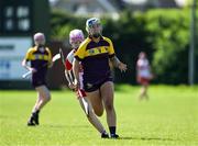 21 April 2024; Orla O’Rourke of Wexford in action against Ellie Griffin of Derry during the Electric Ireland All-Ireland Camogie Minor A Shield semi-final match between Derry and Wexford at Clane in Kildare. Photo by Daire Brennan/Sportsfile