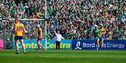 21 April 2024; Umpire Jim McEvoy, from Blarney GAA Club, waves the green flag, for Limerick's third goal, during the Munster GAA Hurling Senior Championship Round 1 match between Clare and Limerick at Cusack Park in Ennis, Clare. Photo by Ray McManus/Sportsfile