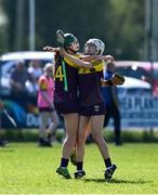 21 April 2024; Wexford players Shauna Mac Sweeney, left, and Abbie Doyle celebrate after the Electric Ireland All-Ireland Camogie Minor A Shield semi-final match between Derry and Wexford at Clane in Kildare. Photo by Daire Brennan/Sportsfile