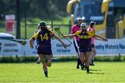21 April 2024; Wexford players Shauna Mac Sweeney, left, and Jane Murphy celebrate after the Electric Ireland All-Ireland Camogie Minor A Shield semi-final match between Derry and Wexford at Clane in Kildare. Photo by Daire Brennan/Sportsfile