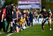 21 April 2024; Daire Cregg of Roscommon in action against Tommy Conroy of Mayo during the Connacht GAA Football Senior Championship semi-final match between Roscommon and Mayo at Dr Hyde Park in Roscommon. Photo by Piaras Ó Mídheach/Sportsfile