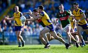 21 April 2024; Brian Stack of Roscommon in action against Tommy Conroy of Mayo during the Connacht GAA Football Senior Championship semi-final match between Roscommon and Mayo at Dr Hyde Park in Roscommon. Photo by Piaras Ó Mídheach/Sportsfile