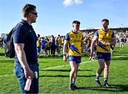 21 April 2024; Roscommon players Niall Higgins, left, and Eoin McCormack leave the pitch after their side's defeat in the Connacht GAA Football Senior Championship semi-final match between Roscommon and Mayo at Dr Hyde Park in Roscommon. Photo by Piaras Ó Mídheach/Sportsfile