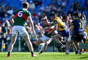 21 April 2024; Ryan O'Donoghue of Mayo shoots under pressure from Niall Higgins of Roscommon during the Connacht GAA Football Senior Championship semi-final match between Roscommon and Mayo at Dr Hyde Park in Roscommon. Photo by Piaras Ó Mídheach/Sportsfile