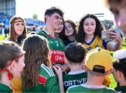 21 April 2024; Tommy Conroy of Mayo with supporters after the Connacht GAA Football Senior Championship semi-final match between Roscommon and Mayo at Dr Hyde Park in Roscommon. Photo by Piaras Ó Mídheach/Sportsfile