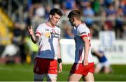 21 April 2024; Tyrone players Nathan McCarron, left, and Lorcan McGarrity congratulate each other after their side's victory in the Ulster GAA Football Senior Championship quarter-final match between Cavan and Tyrone at Kingspan Breffni in Cavan. Photo by Seb Daly/Sportsfile