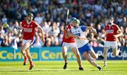 21 April 2024; Michael Kiely of Waterford is tackled by Sean O'Donoghue of Cork during the Munster GAA Hurling Senior Championship Round 1 match between Waterford and Cork at Walsh Park in Waterford. Photo by Brendan Moran/Sportsfile