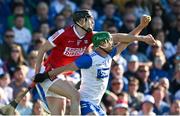 21 April 2024; Michael Kiely of Waterford gathers possession ahead of Robert Downey of Cork during the Munster GAA Hurling Senior Championship Round 1 match between Waterford and Cork at Walsh Park in Waterford. Photo by Brendan Moran/Sportsfile