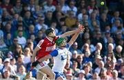 21 April 2024; Michael Kiely of Waterford gathers possession ahead of Robert Downey of Cork during the Munster GAA Hurling Senior Championship Round 1 match between Waterford and Cork at Walsh Park in Waterford. Photo by Brendan Moran/Sportsfile