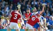 21 April 2024; Michael Kiely of Waterford gets a handpass away while under pressure from Robert Downey and Ciaran Joyce of Cork during the Munster GAA Hurling Senior Championship Round 1 match between Waterford and Cork at Walsh Park in Waterford. Photo by Brendan Moran/Sportsfile