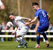 21 April 2024; Raff Cretaro of Mayo Football League in action against Luke Walsh of Waterford & District Junior Football League during the FAI Oscar Traynor Inter-League Cup final match between Mayo Football League and Waterford & District Junior League at Umbro Park, Milebush, Castlebar in Mayo. Photo by Michael P Ryan/Sportsfile