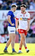 21 April 2024; Michael McKernan of Tyrone and Padraig Faulkner of Cavan during the Ulster GAA Football Senior Championship quarter-final match between Cavan and Tyrone at Kingspan Breffni in Cavan. Photo by Seb Daly/Sportsfile