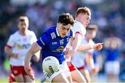 21 April 2024; Oisin Brady of Cavan in action against Sean O’Donnell of Tyrone during the Ulster GAA Football Senior Championship quarter-final match between Cavan and Tyrone at Kingspan Breffni in Cavan. Photo by Seb Daly/Sportsfile
