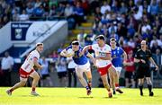 21 April 2024; Niall Carolan of Cavan in action against Darren McCurry of Tyrone during the Ulster GAA Football Senior Championship quarter-final match between Cavan and Tyrone at Kingspan Breffni in Cavan. Photo by Seb Daly/Sportsfile