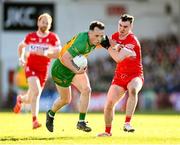 20 April 2024; Aaron Doherty of Donegal in action against Diarmuid Baker of Derry during the Ulster GAA Football Senior Championship quarter-final match between Derry and Donegal at Celtic Park in Derry. Photo by Stephen McCarthy/Sportsfile