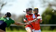 21 April 2024; Aoibhín Donohue of Armagh scores her side's third goal despite the efforts of India Mernagh of Carlow during the Electric Ireland All-Ireland Camogie Minor B semi-final match between Armagh and Carlow at Dunganny in Meath. Photo by Sam Barnes/Sportsfile