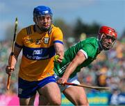 21 April 2024; Shane O'Donnell of Clare is tackled by Barry Nash of Limerick during the Munster GAA Hurling Senior Championship Round 1 match between Clare and Limerick at Cusack Park in Ennis, Clare. Photo by Ray McManus/Sportsfile