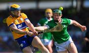 21 April 2024; Seadna Morey of Clare is tackled by Will O Donoghue of Limerick during the Munster GAA Hurling Senior Championship Round 1 match between Clare and Limerick at Cusack Park in Ennis, Clare. Photo by Ray McManus/Sportsfile