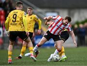 22 April 2024; Will Patching of Derry City in action against Brandon Kavanagh of St Patrick's Athleticduring the SSE Airtricity Men's Premier Division match between Derry City and St Patrick's Athletic at The Ryan McBride Brandywell Stadium in Derry. Photo by Piaras Ó Mídheach/Sportsfile