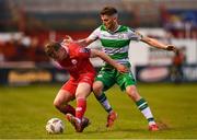 22 April 2024; JJ Lunney of Shelbourne in action against Dylan Watts of Shamrock Rovers during the SSE Airtricity Men's Premier Division match between Shelbourne and Shamrock Rovers at Tolka Park in Dublin. Photo by Stephen McCarthy/Sportsfile