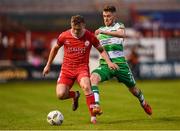 22 April 2024; JJ Lunney of Shelbourne in action against Dylan Watts of Shamrock Rovers during the SSE Airtricity Men's Premier Division match between Shelbourne and Shamrock Rovers at Tolka Park in Dublin. Photo by Stephen McCarthy/Sportsfile