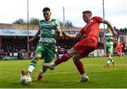 22 April 2024; Kameron Ledwidge of Shelbourne in action against Dylan Watts of Shamrock Rovers during the SSE Airtricity Men's Premier Division match between Shelbourne and Shamrock Rovers at Tolka Park in Dublin. Photo by Shauna Clinton/Sportsfile
