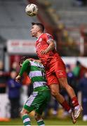 22 April 2024; John O'Sullivan of Shelbourne in action against Trevor Clarke of Shamrock Rovers during the SSE Airtricity Men's Premier Division match between Shelbourne and Shamrock Rovers at Tolka Park in Dublin. Photo by Stephen McCarthy/Sportsfile