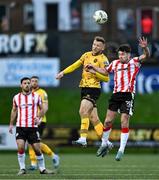 22 April 2024; Jamie Lennon of St Patrick's Athletic in action against Adam O'Reilly of Derry City during the SSE Airtricity Men's Premier Division match between Derry City and St Patrick's Athletic at The Ryan McBride Brandywell Stadium in Derry. Photo by Piaras Ó Mídheach/Sportsfile