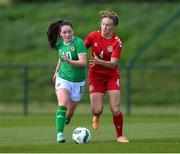 23 April 2024; Leah McGrath of Republic of Ireland in action against Hannah Jorgensen of Denmark during the women's under 16's international friendly match between Republic of Ireland and Denmark at the FAI National Training Centre in Abbotstown, Dublin. Photo by Stephen McCarthy/Sportsfile