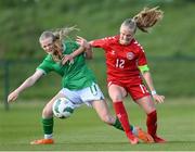 23 April 2024; Martha Hesselholt of Denmark in action against Maeve Wollmer of Republic of Ireland during the women's under 16's international friendly match between Republic of Ireland and Denmark at the FAI National Training Centre in Abbotstown, Dublin. Photo by Stephen McCarthy/Sportsfile
