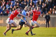 23 April 2024; Evan Nugent of Dublin in action against Pearse Grimes Murphy, left, and Fionn Tipping of Louth during the EirGrid Leinster GAA Football U20 Championship semi-final match between Dublin and Louth at Parnell Park in Dublin. Photo by Sam Barnes/Sportsfile