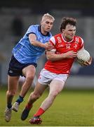 23 April 2024; Sean Reynolds of Louth in action against Evan Nugent of Dublin during the EirGrid Leinster GAA Football U20 Championship semi-final match between Dublin and Louth at Parnell Park in Dublin. Photo by Sam Barnes/Sportsfile