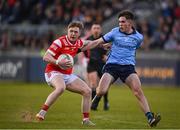 23 April 2024; Liam Flynn of Louth in action against Seán Kirwan of Dublin during the EirGrid Leinster GAA Football U20 Championship semi-final match between Dublin and Louth at Parnell Park in Dublin. Photo by Sam Barnes/Sportsfile