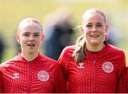 23 April 2024; Denmark players Marie Dahlmann and Louise Strauss stand for the playing of the National Anthem before the women's under 16's international friendly match between Republic of Ireland and Denmark at the FAI National Training Centre in Abbotstown, Dublin. Photo by Stephen McCarthy/Sportsfile