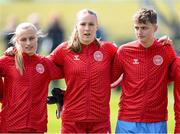 23 April 2024; Denmark players, from left, Sophia Parkegaard, Hannah Jorgensen and Isabella Damn stand for the playing of the National Anthem before the women's under 16's international friendly match between Republic of Ireland and Denmark at the FAI National Training Centre in Abbotstown, Dublin. Photo by Stephen McCarthy/Sportsfile