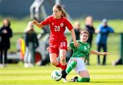 23 April 2024; Ida Skræddergaard Philipsen of Denmark is tackled by Aoife Sheridan of Republic of Ireland during the women's under 16's international friendly match between Republic of Ireland and Denmark at the FAI National Training Centre in Abbotstown, Dublin. Photo by Stephen McCarthy/Sportsfile