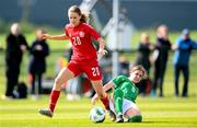 23 April 2024; Ida Skræddergaard Philipsen of Denmark is tackled by Aoife Sheridan of Republic of Ireland during the women's under 16's international friendly match between Republic of Ireland and Denmark at the FAI National Training Centre in Abbotstown, Dublin. Photo by Stephen McCarthy/Sportsfile