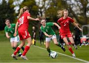 23 April 2024; Sophia Parkegaard of Denmark is tackled by Kate Jones of Republic of Ireland during the women's under 16's international friendly match between Republic of Ireland and Denmark at the FAI National Training Centre in Abbotstown, Dublin. Photo by Stephen McCarthy/Sportsfile
