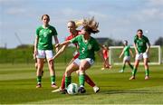 23 April 2024; Kate Jones of Republic of Ireland in action against Mathilde Brandt of Denmark during the women's under 16's international friendly match between Republic of Ireland and Denmark at the FAI National Training Centre in Abbotstown, Dublin. Photo by Stephen McCarthy/Sportsfile