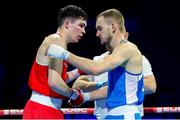 24 April 2024; Adam Hession of Ireland, left, and Eduard Savvin of Russia after their Men's 57kg Featherweight quarter-final bout during the 2024 European Boxing Championships at Aleksandar Nikolic Hall in Belgrade, Serbia. Photo by Nikola Krstic/Sportsfile