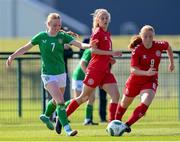 23 April 2024; Aisling Meehan of Republic of Ireland in action against Denmark players Selma Karstensen and Albert Mott, right, during the women's under 16's international friendly match between Republic of Ireland and Denmark at the FAI National Training Centre in Abbotstown, Dublin. Photo by Stephen McCarthy/Sportsfile
