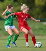 23 April 2024; Julie Olander of Denmark in action against Ella Kelly of Republic of Ireland during the women's under 16's international friendly match between Republic of Ireland and Denmark at the FAI National Training Centre in Abbotstown, Dublin. Photo by Stephen McCarthy/Sportsfile