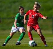 23 April 2024; Julie Olander of Denmark in action against Aoife Sheridan of Republic of Ireland during the women's under 16's international friendly match between Republic of Ireland and Denmark at the FAI National Training Centre in Abbotstown, Dublin. Photo by Stephen McCarthy/Sportsfile