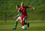 23 April 2024; Julie Olander of Denmark in action against Aoife Sheridan of Republic of Ireland during the women's under 16's international friendly match between Republic of Ireland and Denmark at the FAI National Training Centre in Abbotstown, Dublin. Photo by Stephen McCarthy/Sportsfile