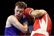 24 April 2024; Dean Clancy of Ireland, left, in action against Malik Hasanov of Azerbaijan in their Men's 63.5kg Light Welterweight quarter-final bout during the 2024 European Boxing Championships at Aleksandar Nikolic Hall in Belgrade, Serbia. Photo by Nikola Krstic/Sportsfile