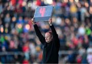 20 April 2024; Sideline official Kevin Faloon holds up a board indicating four minutes of additional time at the end of the Ulster GAA Football Senior Championship quarter-final match between Derry and Donegal at Celtic Park in Derry. Photo by Stephen McCarthy/Sportsfile